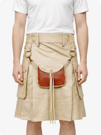Person wearing a beige kilt with a brown leather bag on a white background