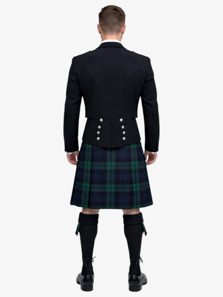 Man wearing a black prince charlie jacket and black watch tartan plaid kilt on a white background