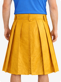 Person wearing a yellow pleated skirt and blue top on a white background