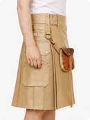 Tan kilt with leather pocket on a white background