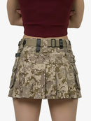 Camouflage skirt with tactical belt on a plain background